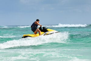 man on yellow jet ski