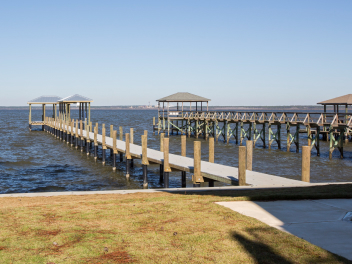 two docks built on Lake Pontchartrain with boathouses