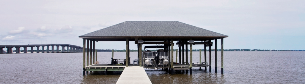 custom built luxury boathouse and boat lift on lake pontchartrain