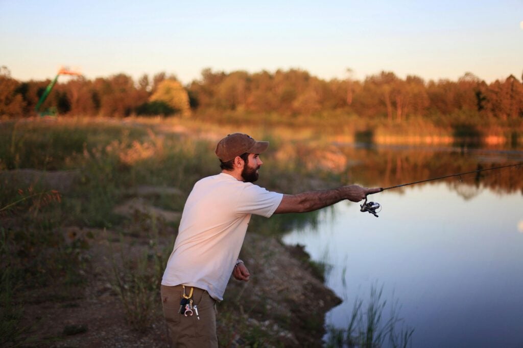 man fishing on lake pontchartrain catching bass
