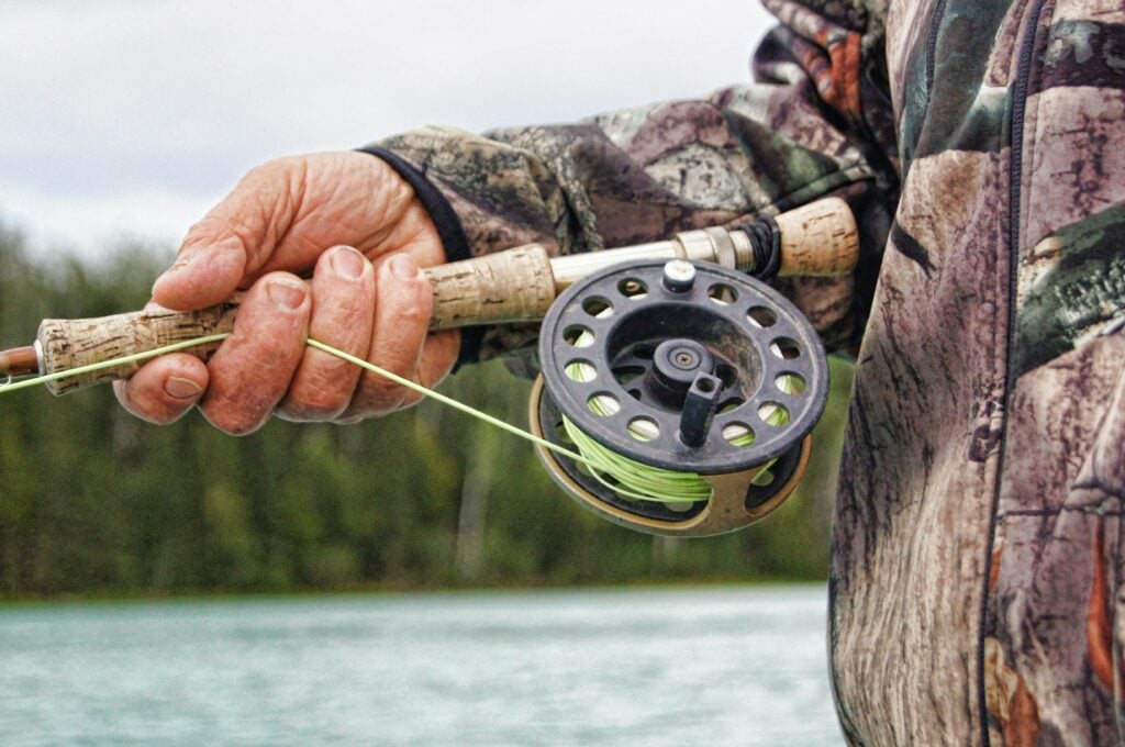 a person holding a fishing rod