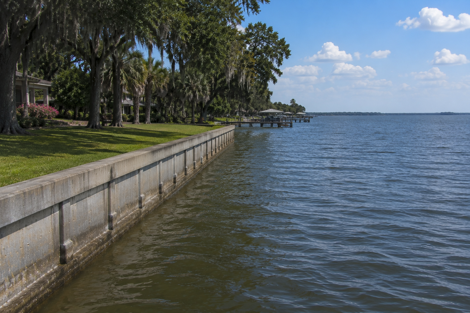 a body of water with a dock and trees